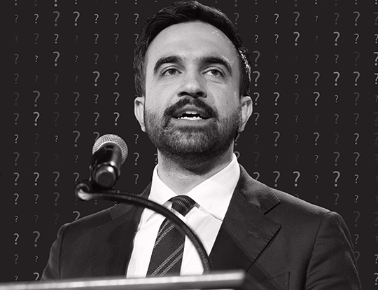 Black and white photo of NYC Mayor Zohran Mamdani speaking at a podium with a microphone, set against a dark background overlaid with question marks.